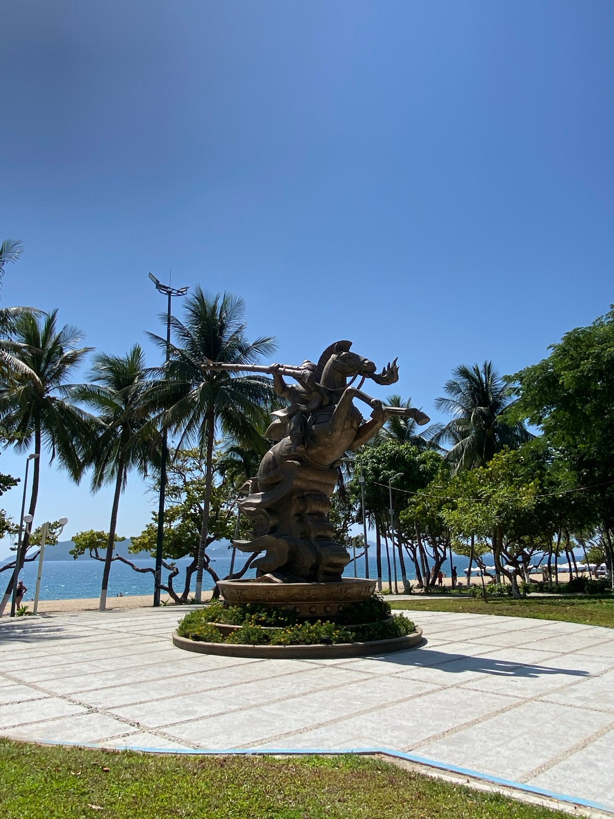 Nha Trang beachside park: statues, tiki carvings, and lizards
