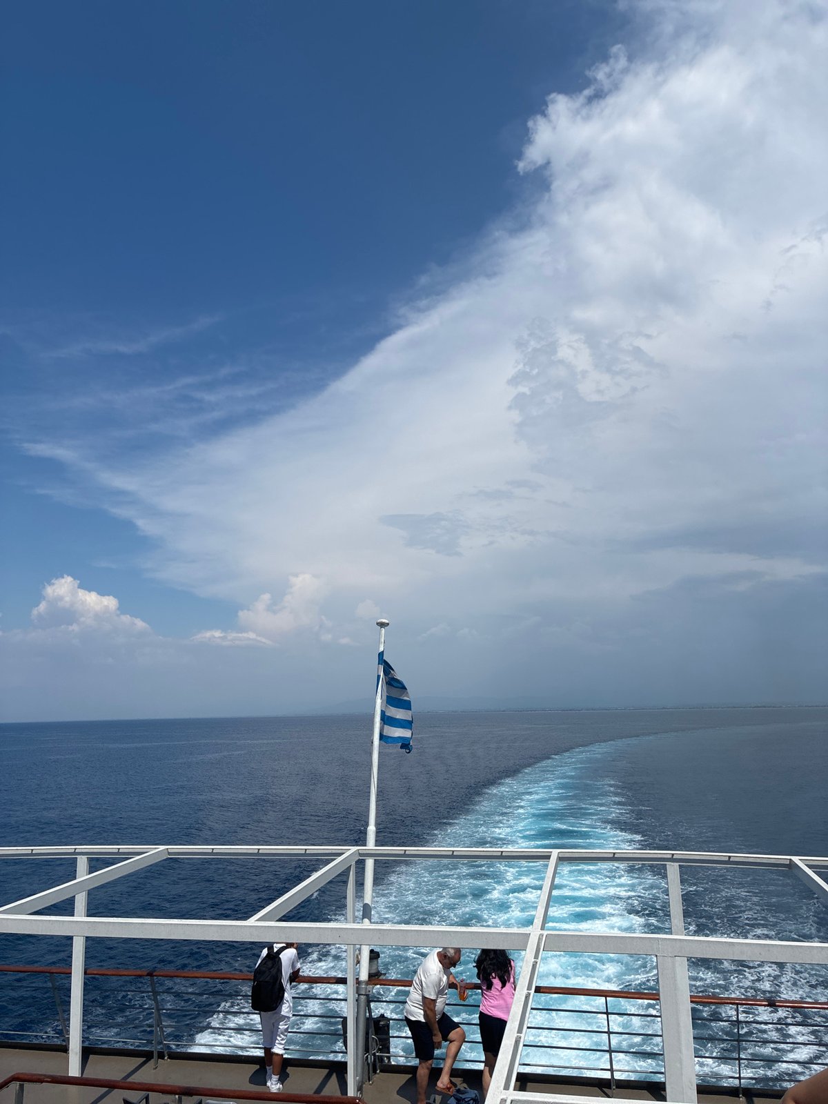 Ferry crossing blue Aegean waters off the Peloponnese coast