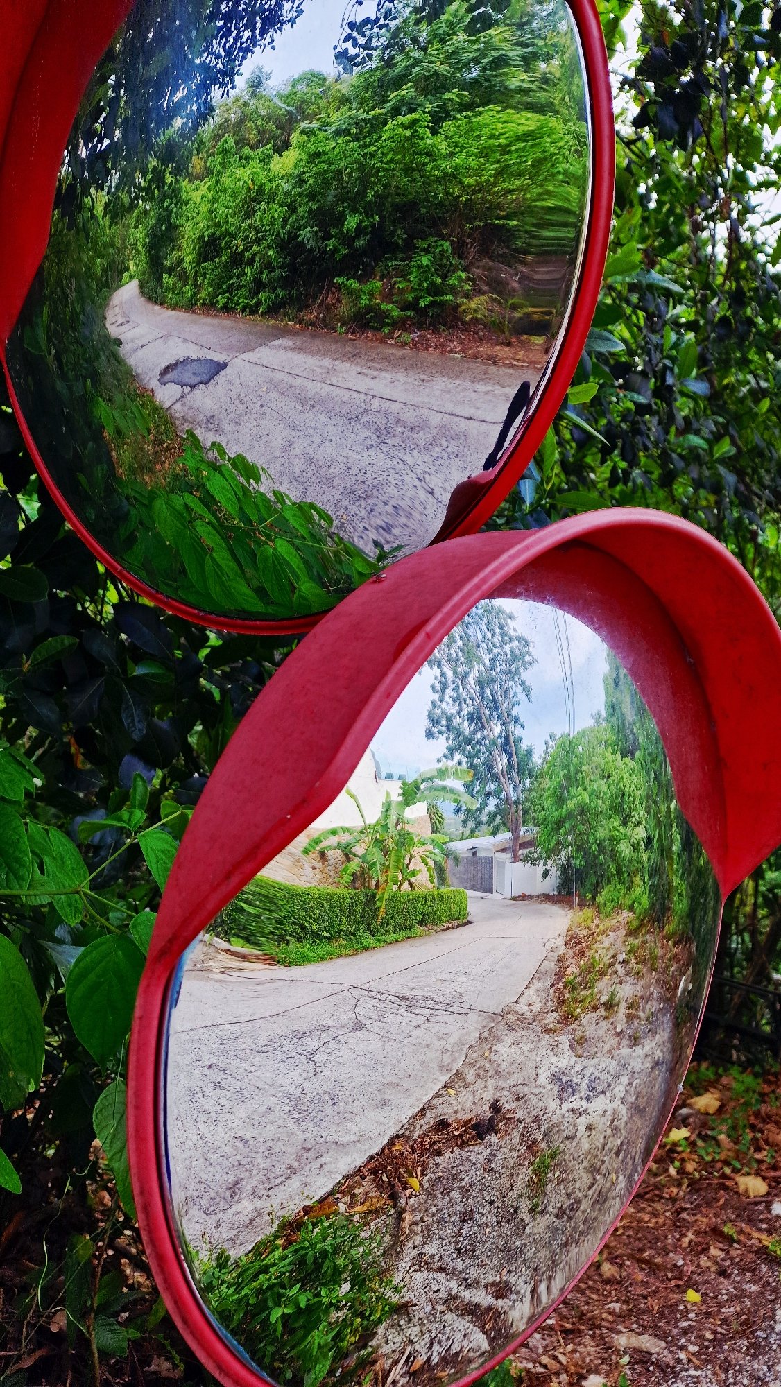 Tourist documents rural road conditions on Ko Samui island