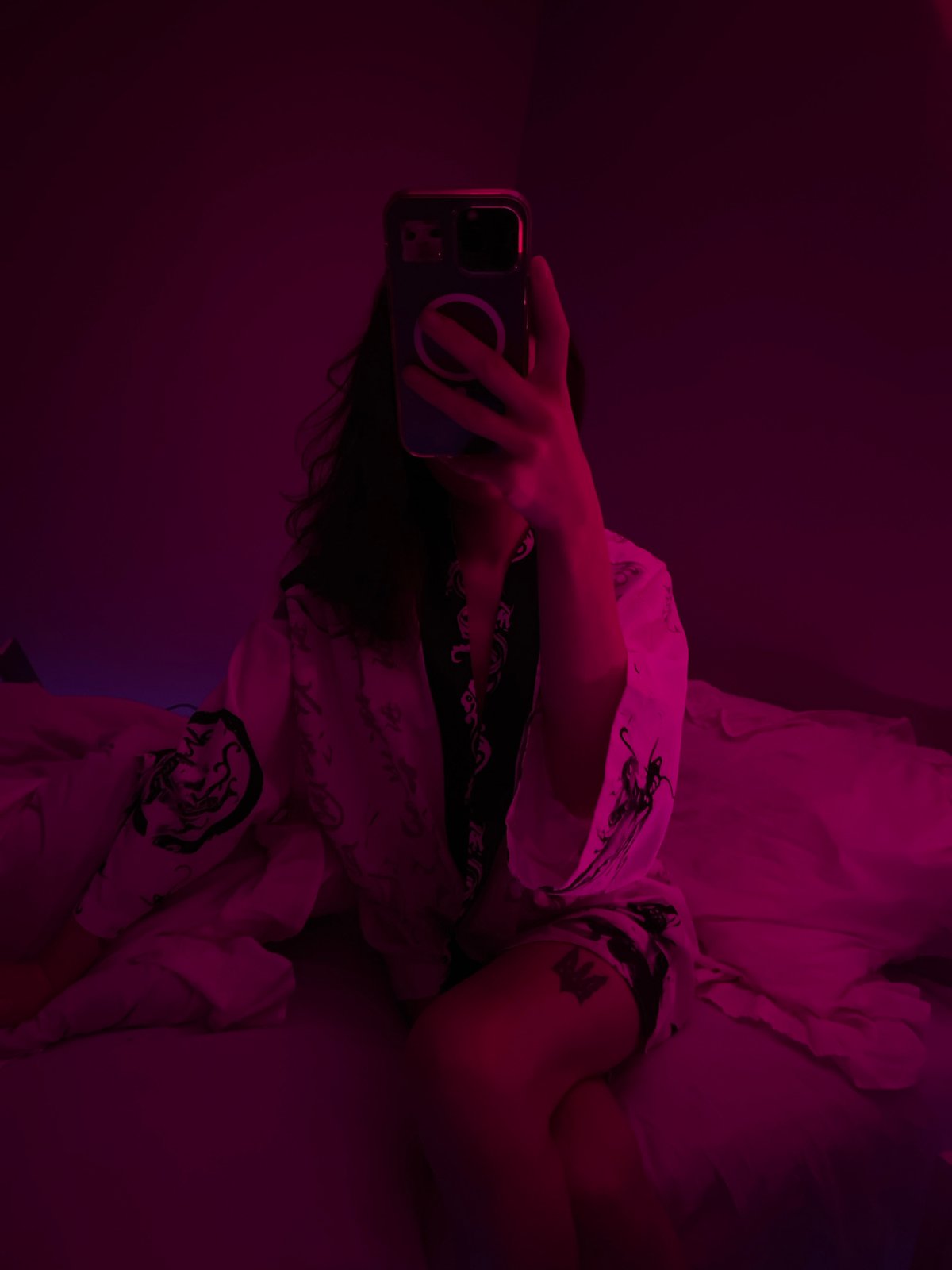 Bedroom selfie session under pink neon lights, Ternopil