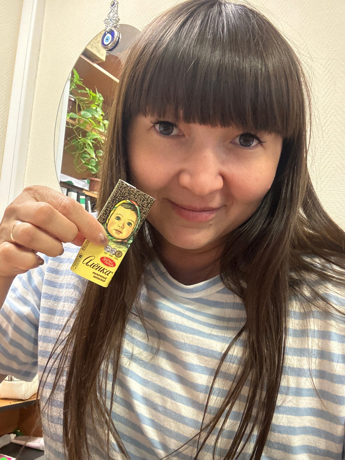 Woman documents quiet morning moments with selfies, cat in Chaikovsky