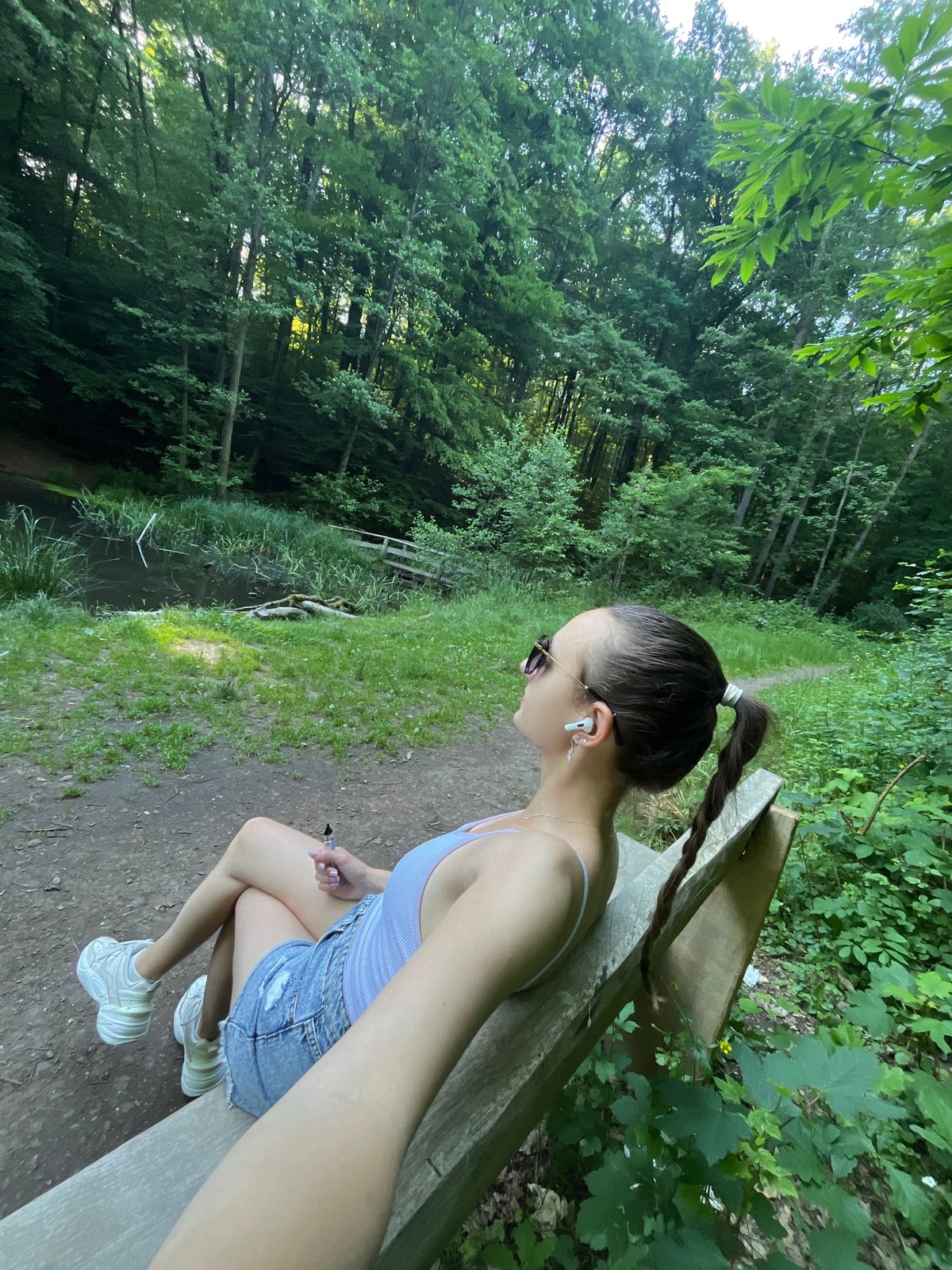 Woman enjoys leisurely afternoon at Saarbrücken waterside park