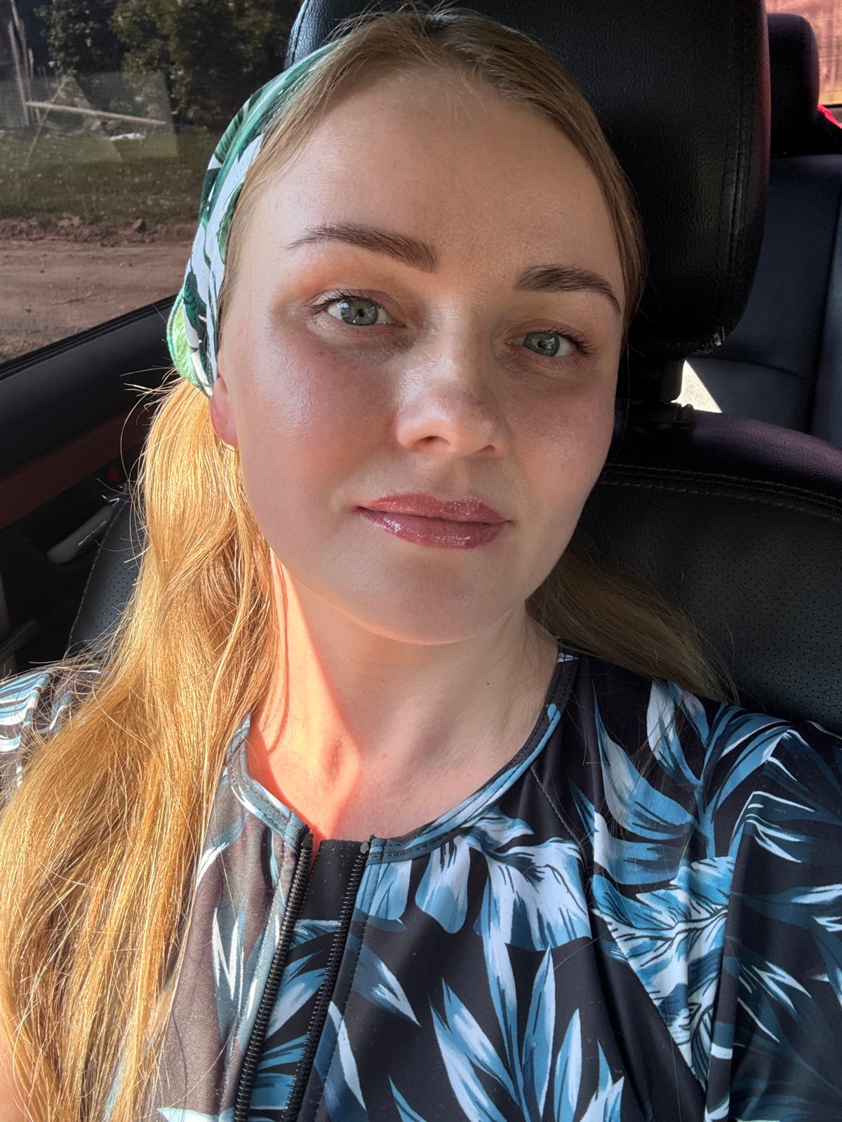 Woman in floral top observed in car in Chaikovsky