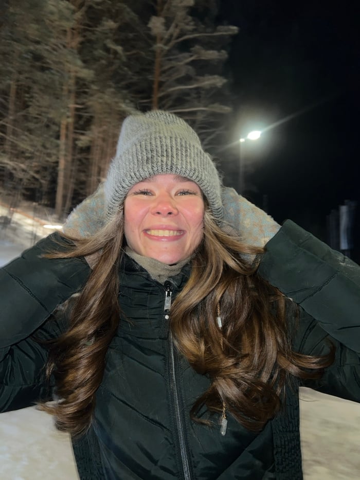 Woman photographed at winter night locations across Krasnoyarsk, Russia