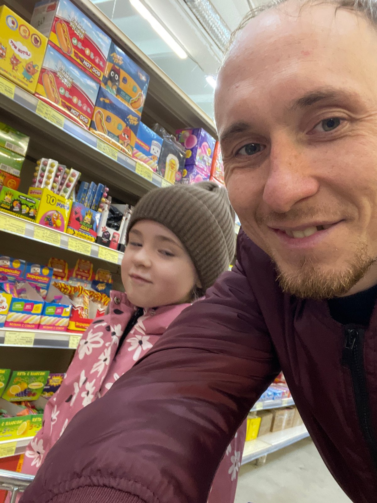 Father and daughter take selfie in Sarapul store