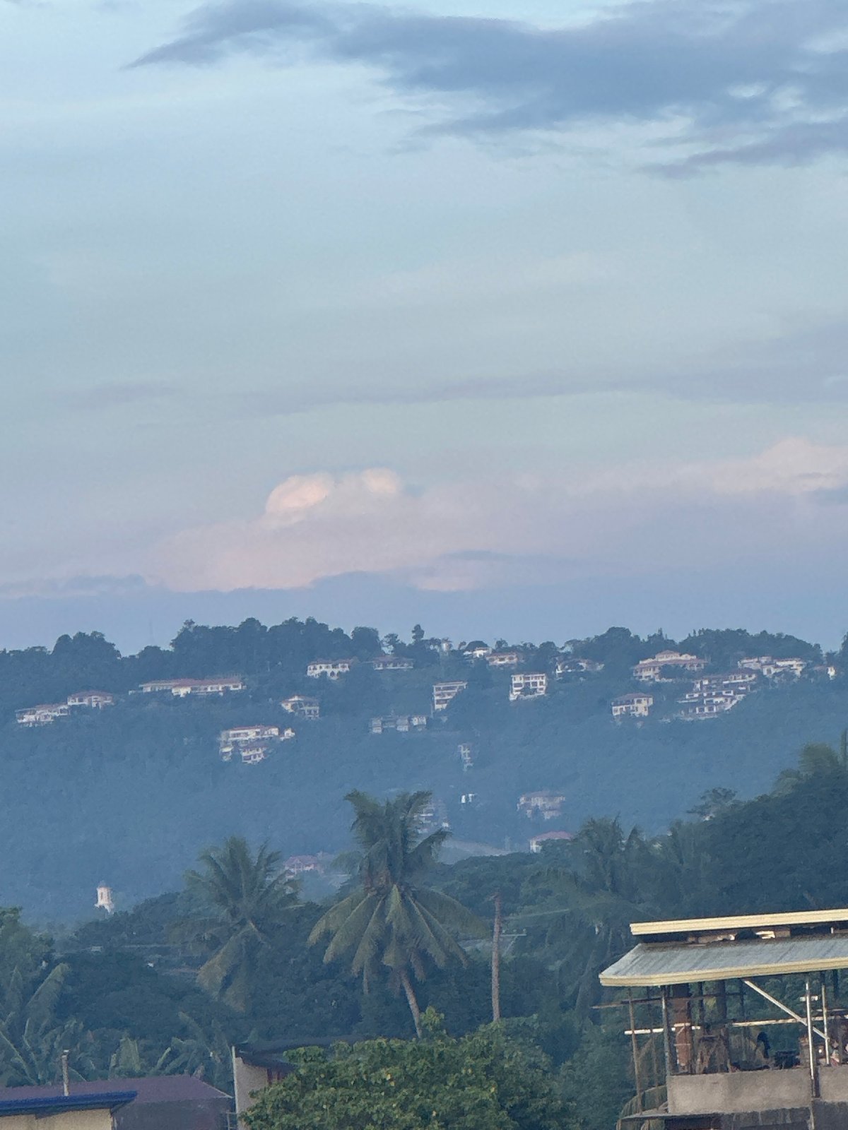 Observer documents Davao City evening views from elevated balcony