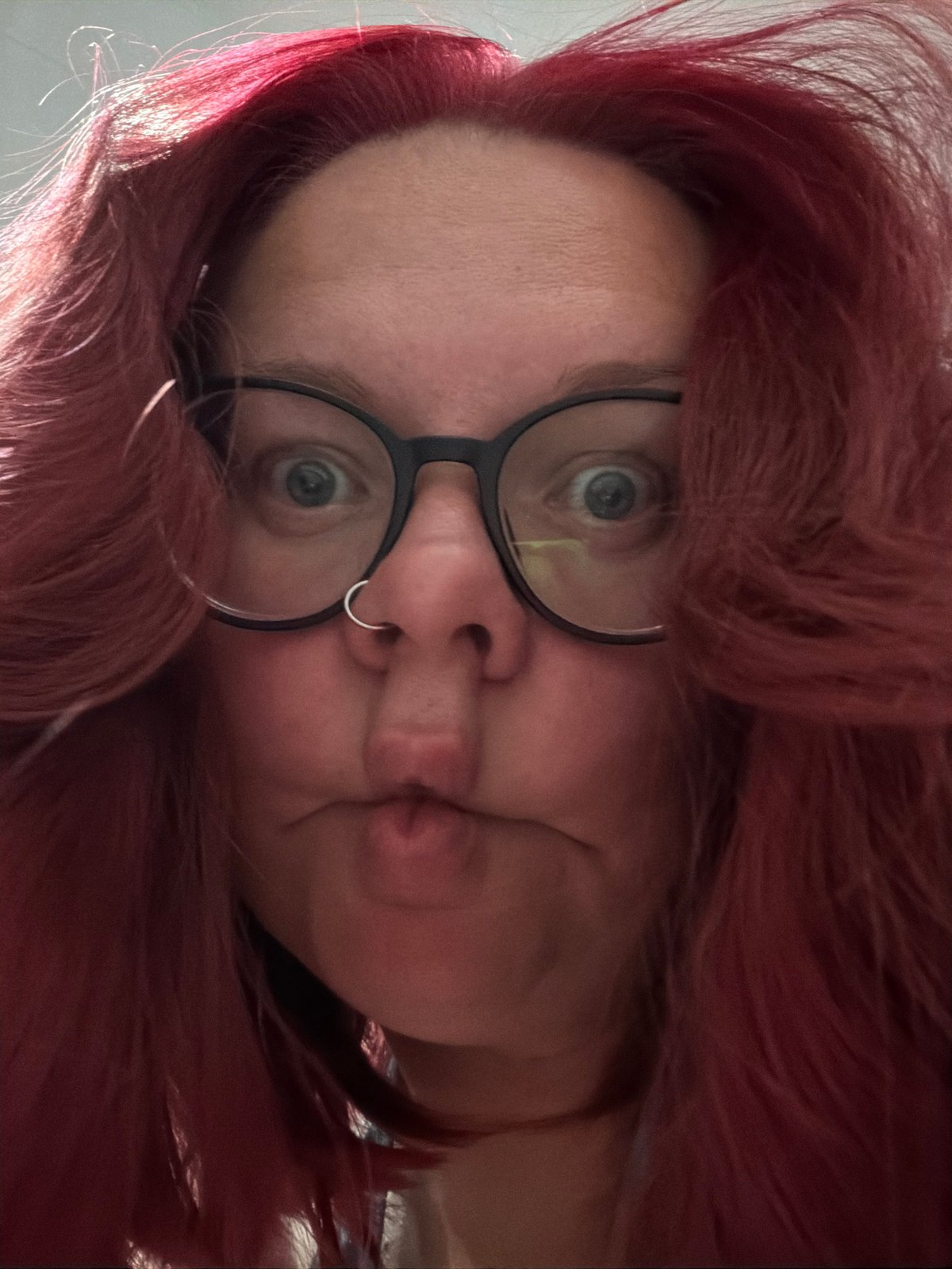 Portrait captured in Chaikovsky shows red-haired individual with glasses