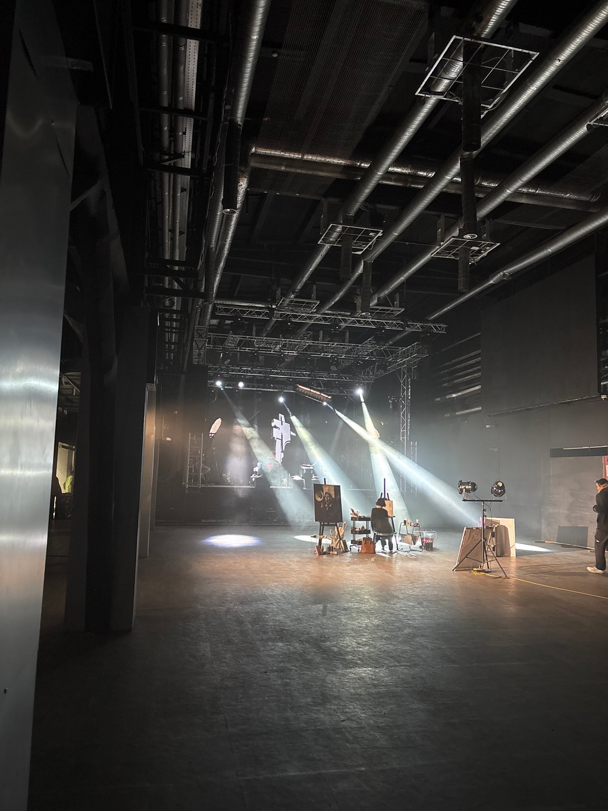 Television production filmed at Moscow venue with artist painting