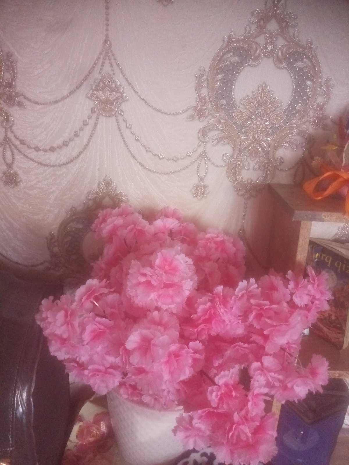 Inside a decorated Namangan room with flowers and books