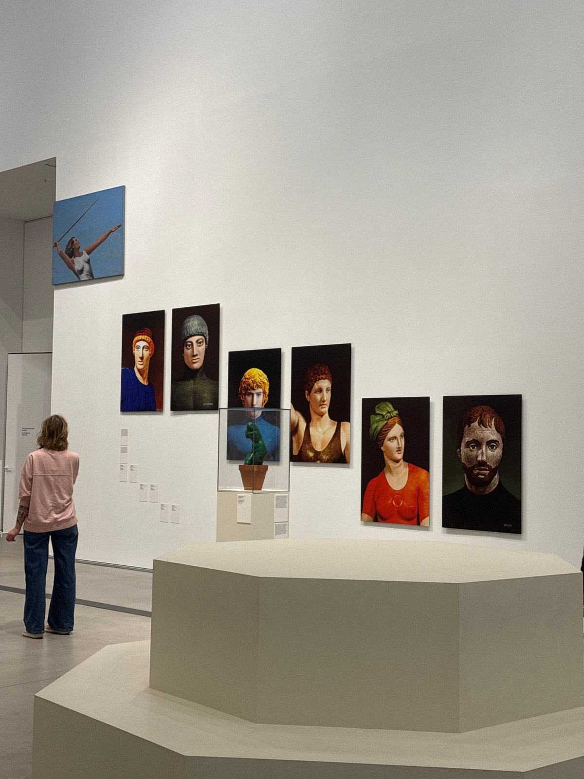 Gallery visitor views portrait collection in Moscow museum