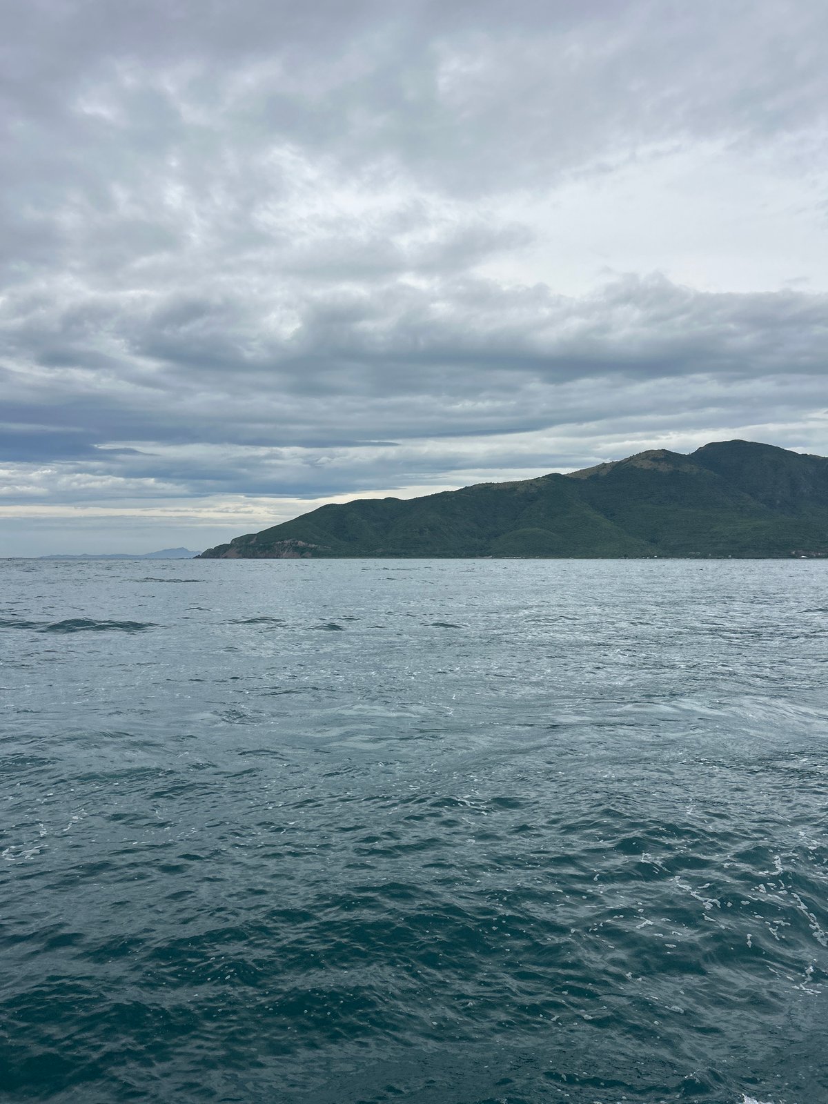 Passenger boats crossing choppy waters off Nha Trang's coastline