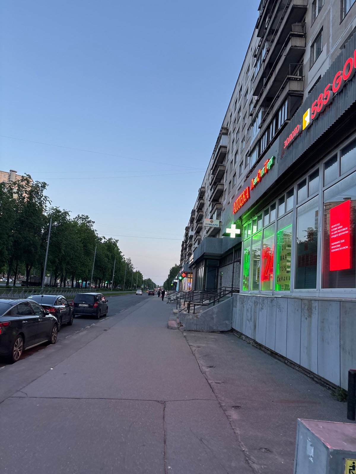 Urban street scene with multi-story building documented in Russia