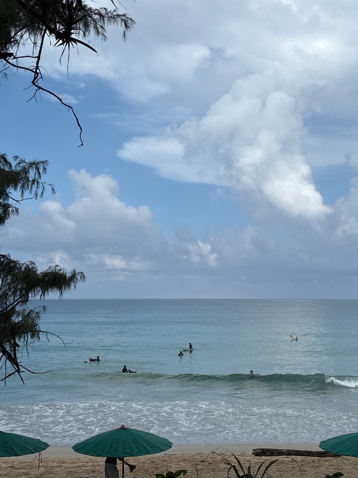 Rainy morning at Karon Beach, street and shoreline scenes