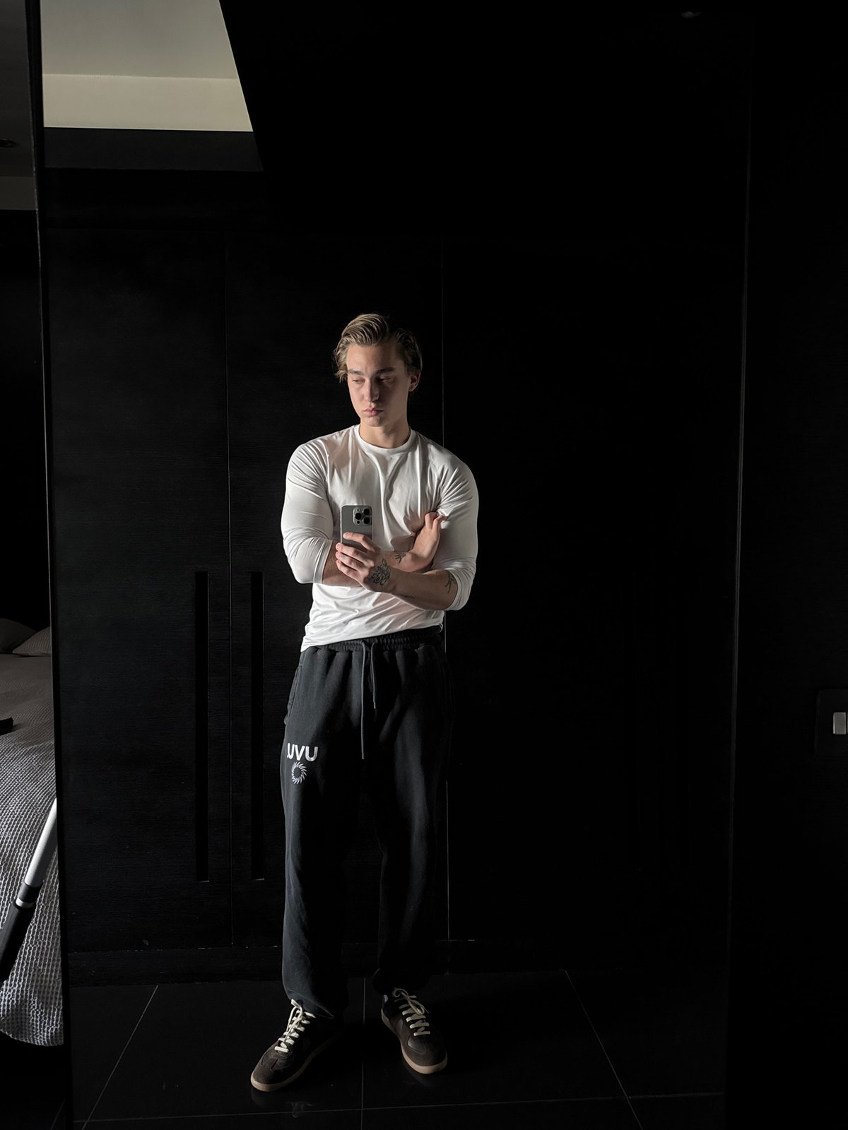 London resident captured changing shoes in indoor setting