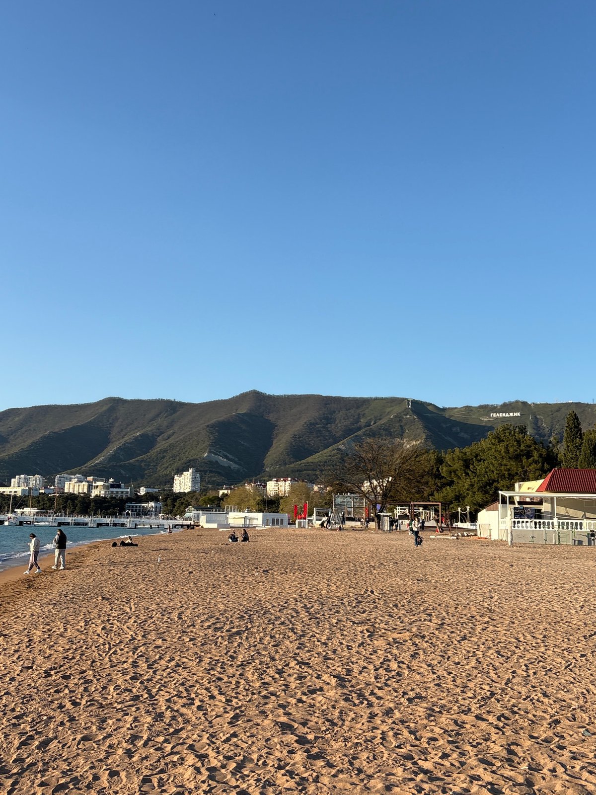 Visitor documents sunset beach experience in Gelendzhik, Russia