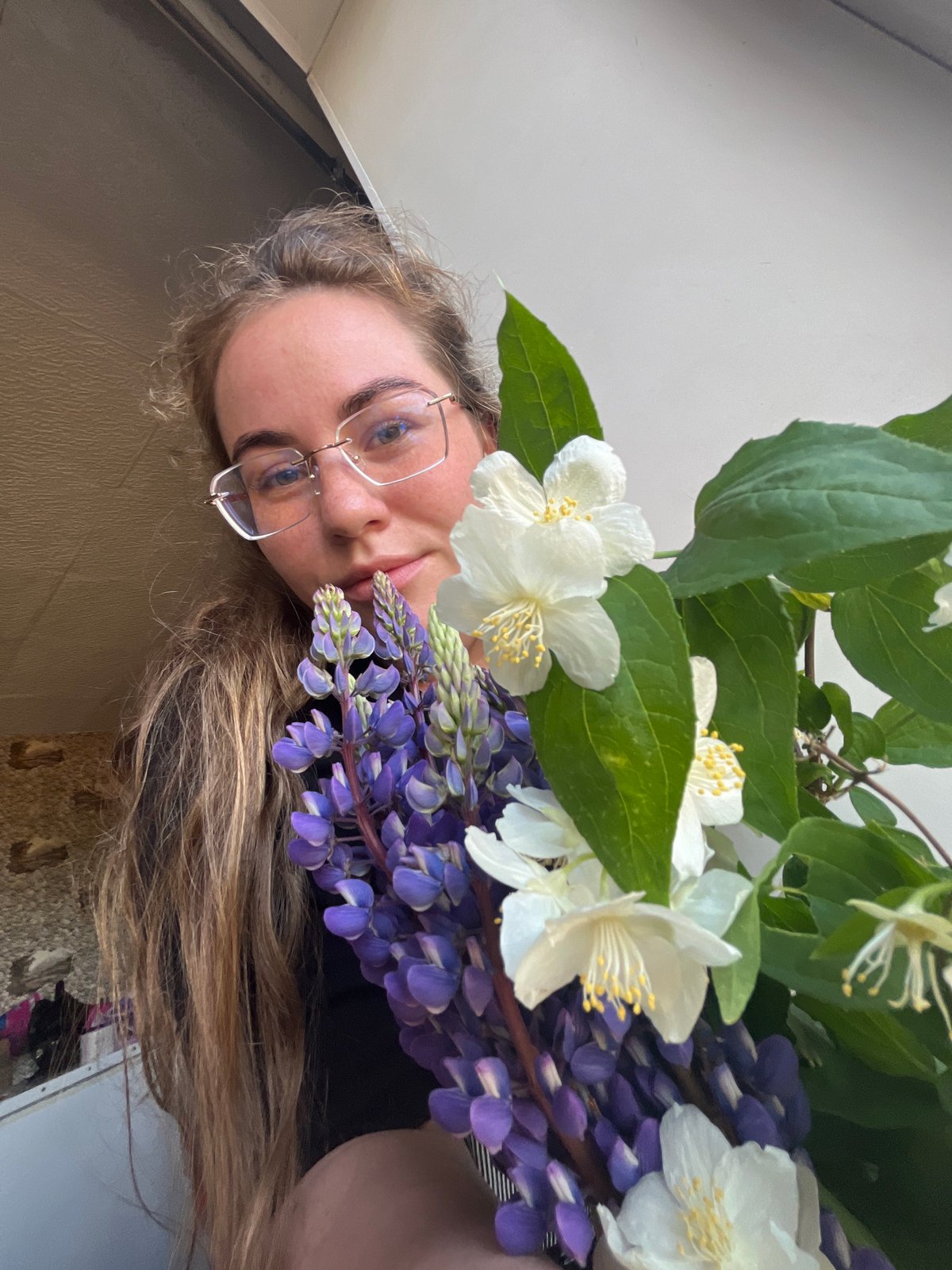 Woman documents morning nature walk with wildflower photography in Russia
