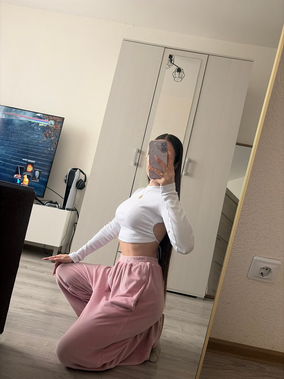 Woman takes mirror selfies in Saint Petersburg gaming room