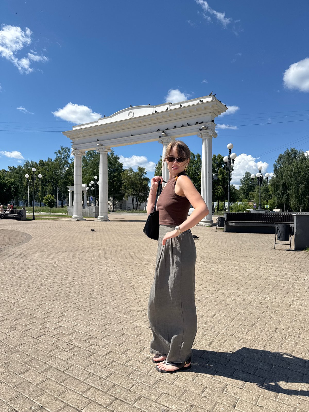 Morning outing in Chaikovsky: woman and boy explore city square
