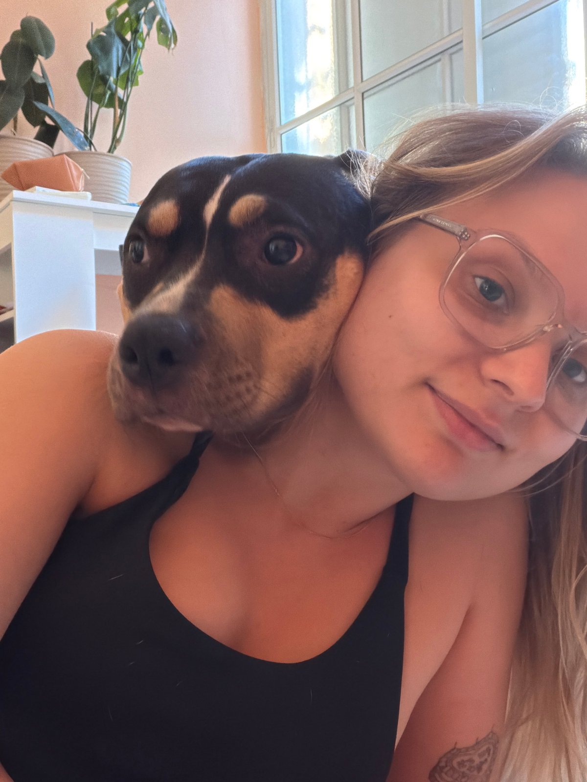 Woman and tri-colored dog photographed together in Tel-Aviv