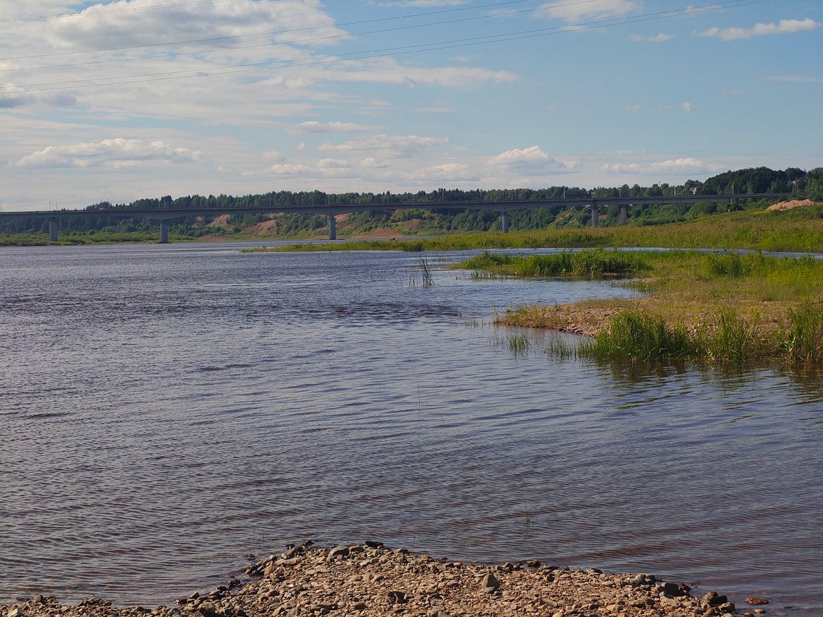 Calm river and rocky shoreline near Velikiy Ustyug, Russia