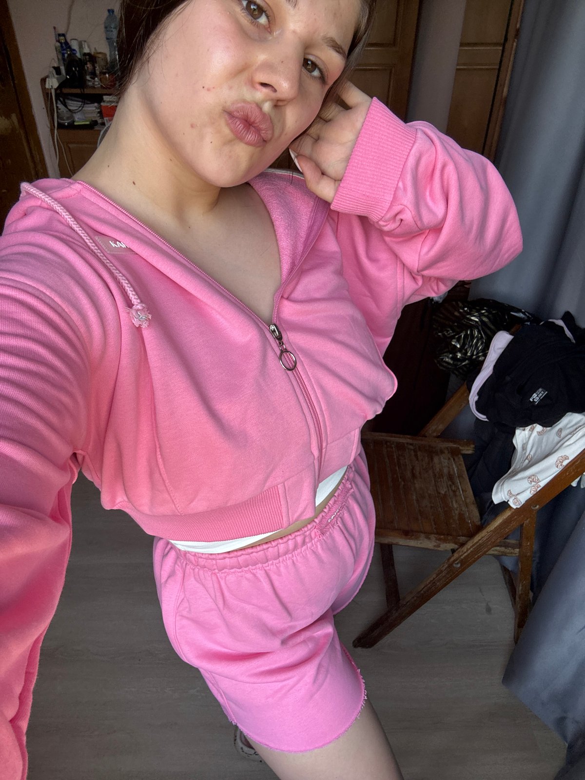 Bedroom selfie session in a pink tracksuit