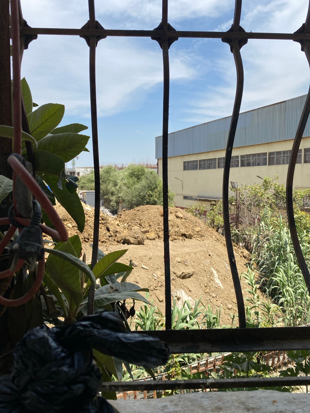 Coffee indoors, construction outside — a quiet moment in Baraki