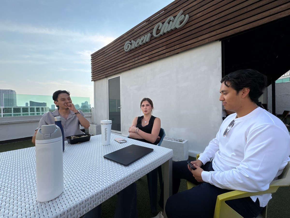 Friends gather for rooftop meal in Puebla, Mexico