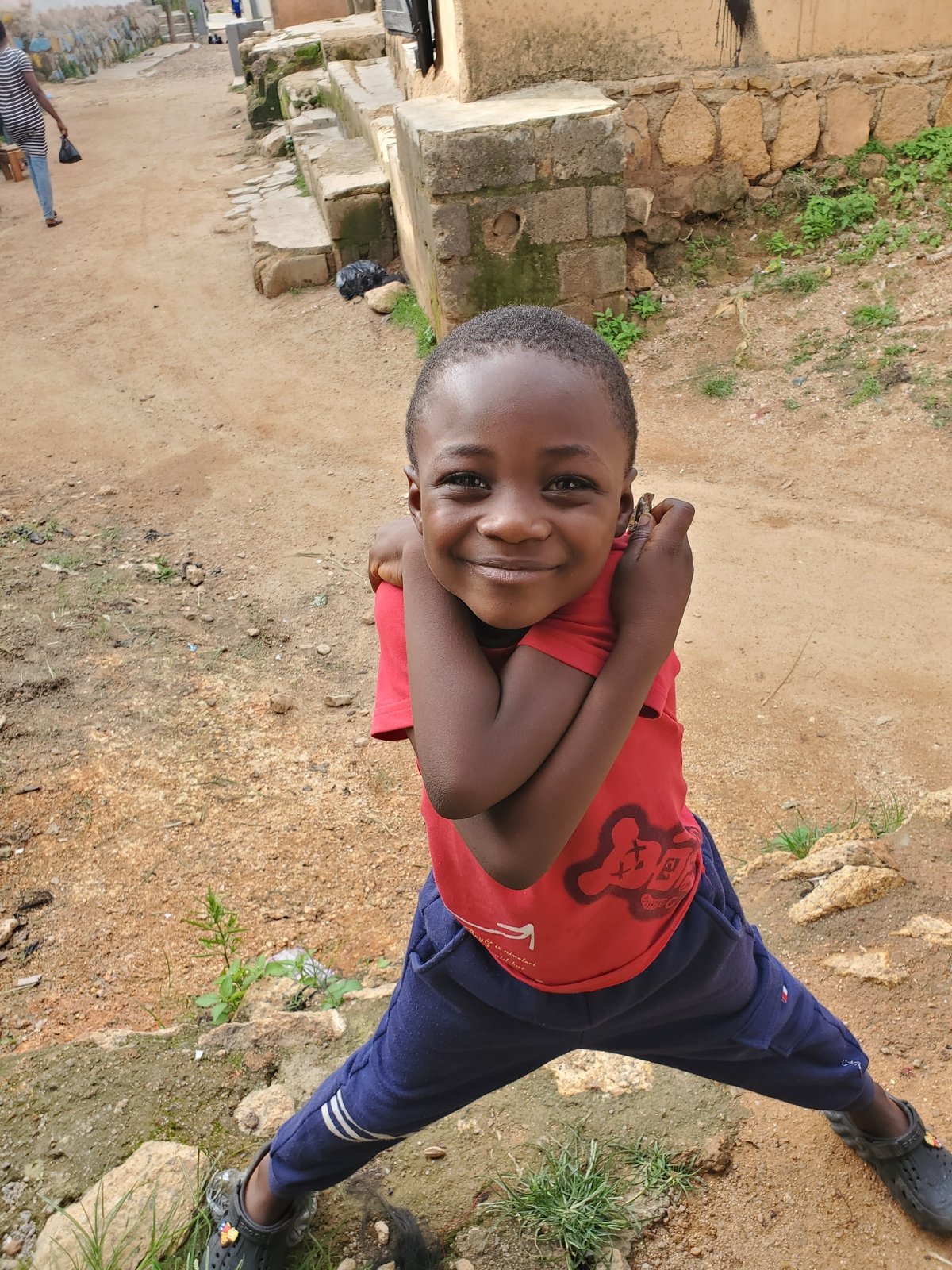 Afternoon in a Jos neighborhood, streets and a kid in red