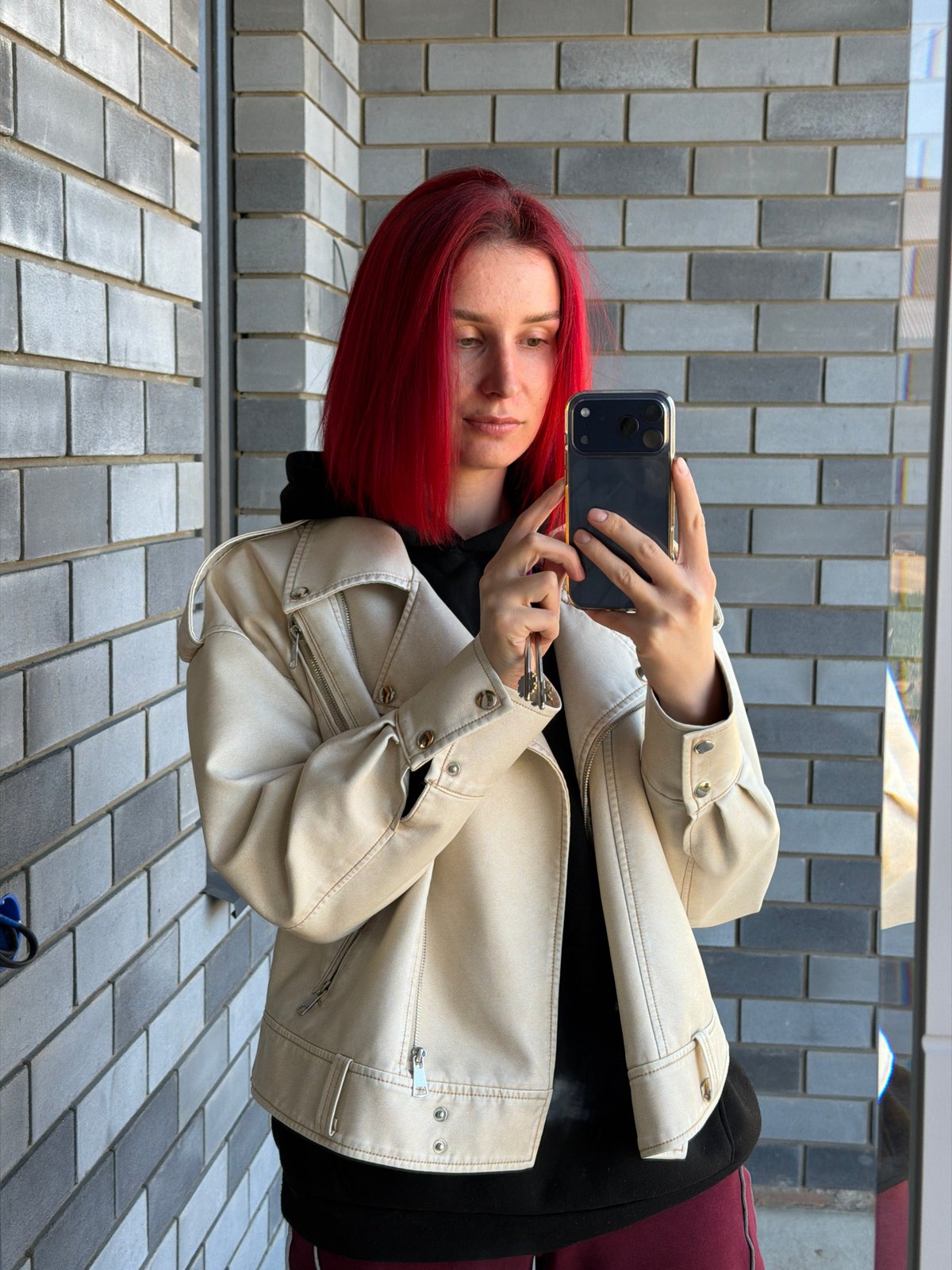 Woman takes selfie while holding keys in Chaikovsky