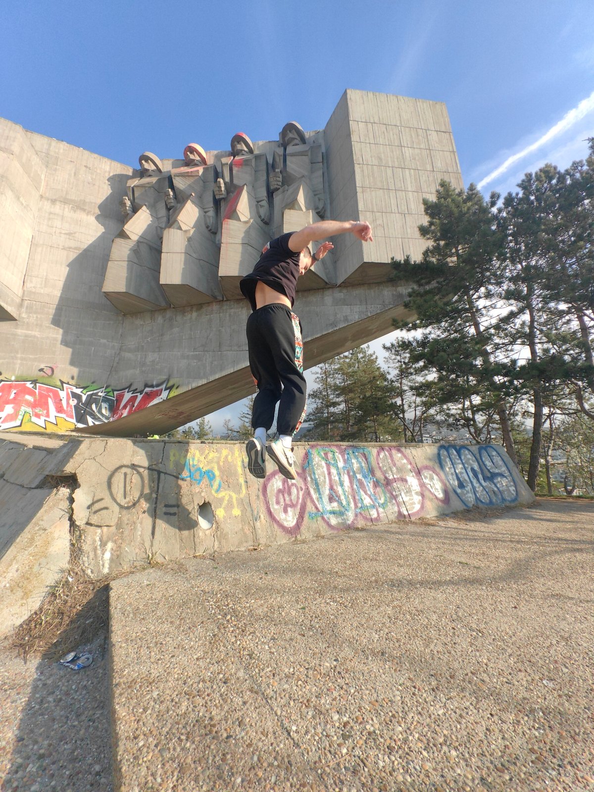 Person performs acrobatics at Soviet friendship monument in Varna