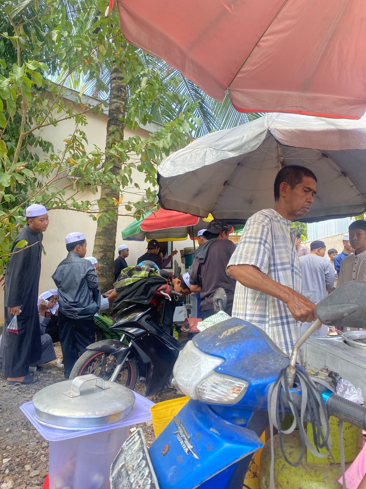 Street vendor scene draws a crowd in Banjarbaru, Indonesia