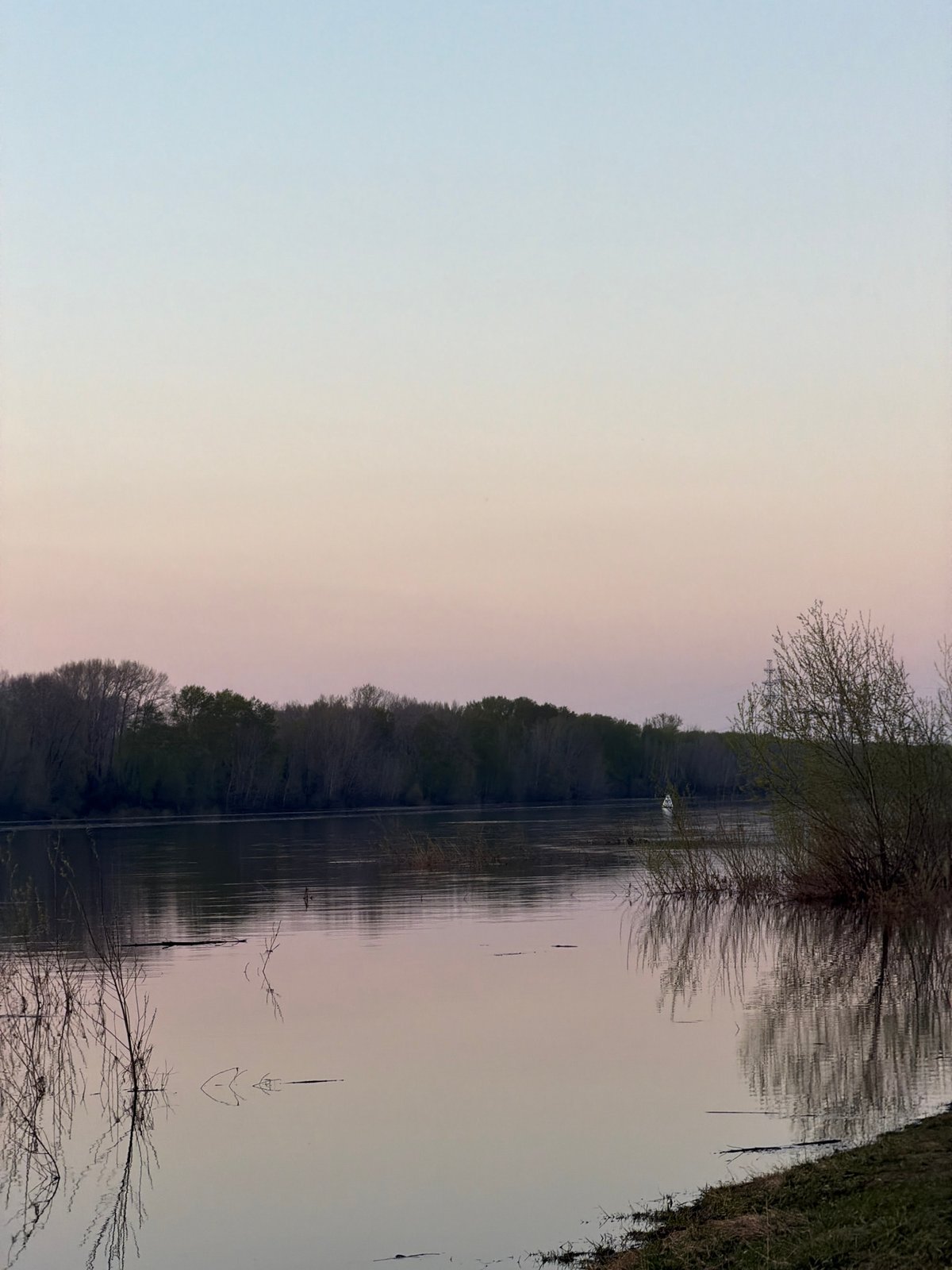 Woman documents sunset lakeside visit in Chaikovsky, Russia