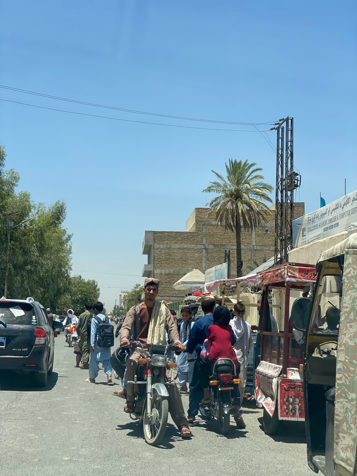 Street life in motion across central Kandahar