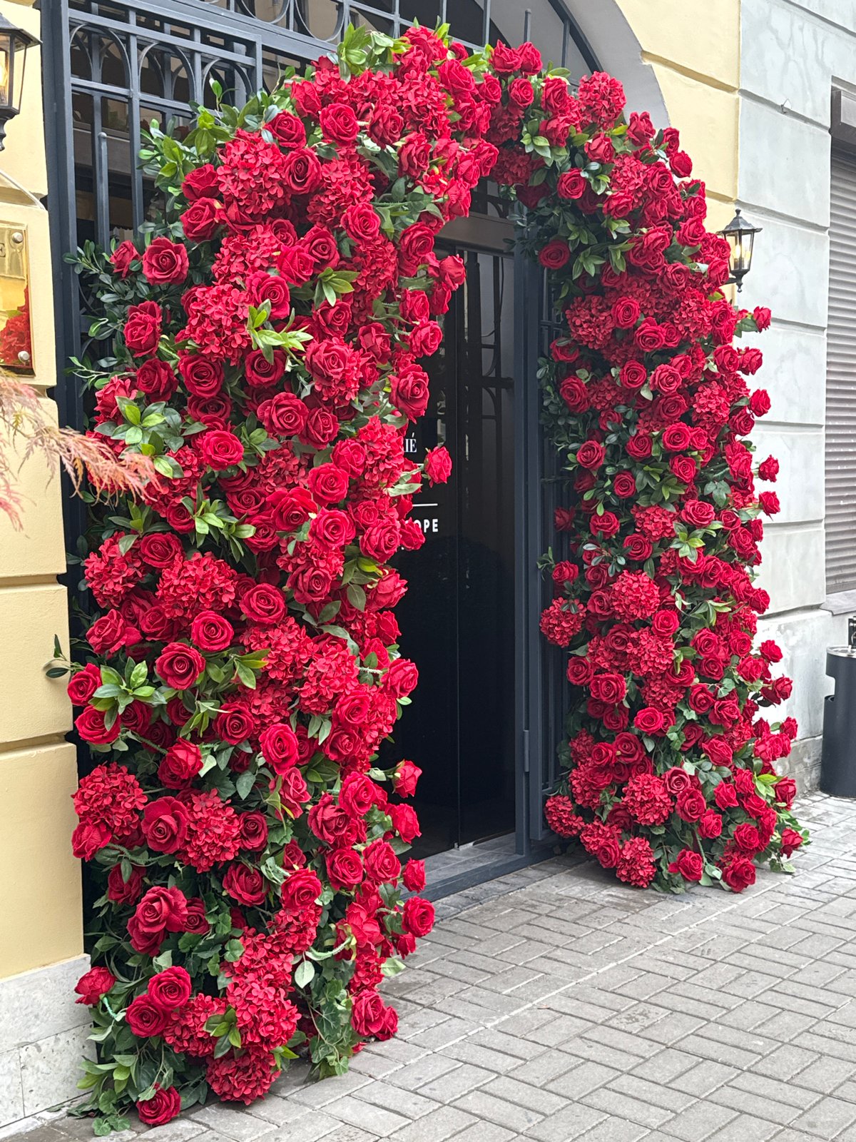 Street scene captured in Saint Petersburg with flowers, café, motorcycle