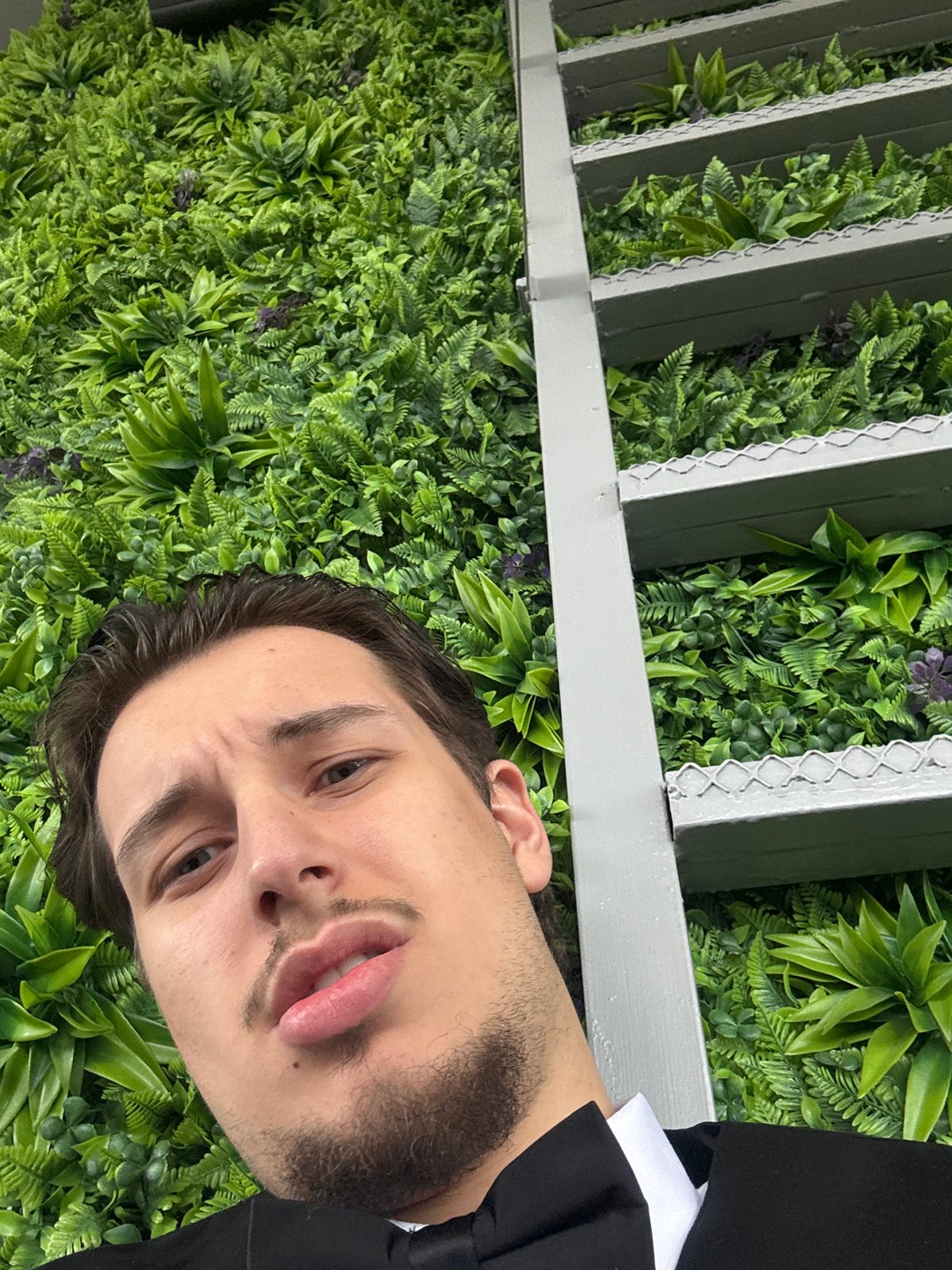 Formal-dressed man photographed in multiple Sofia locations during morning