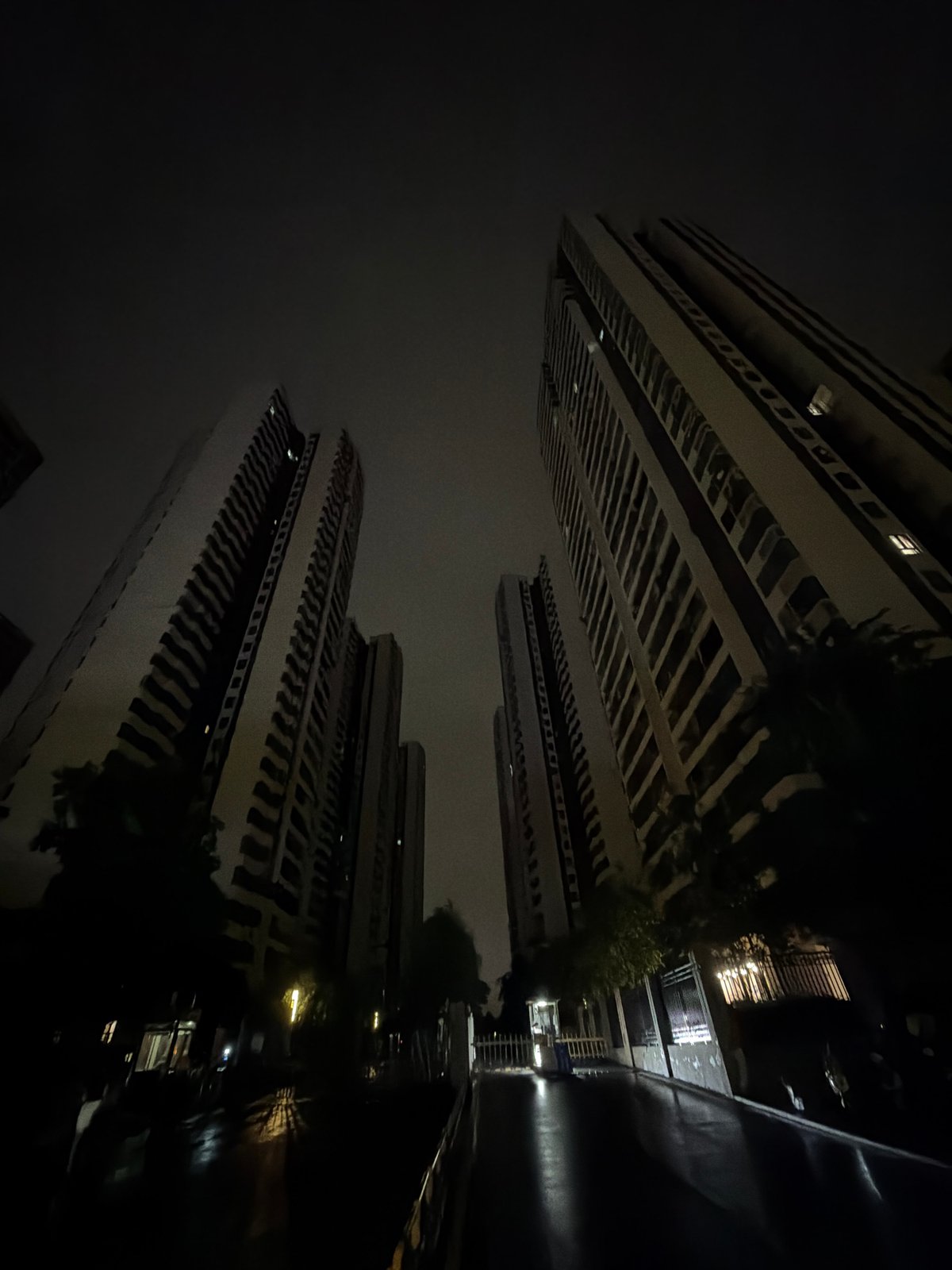 Rainy night in Chongqing's High-tech Zone, streets wet and quiet