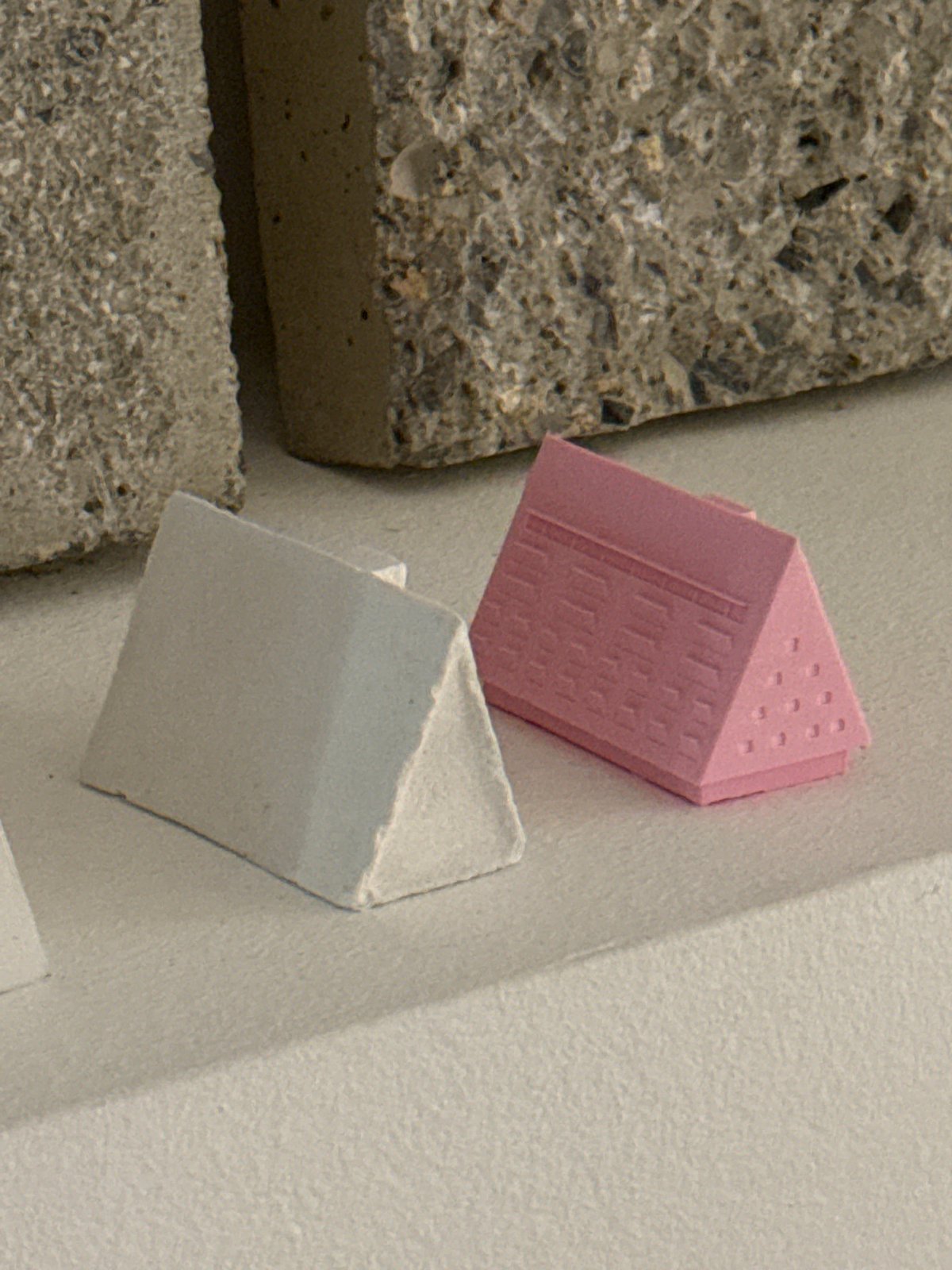 Architectural workspace documented in Milan with models and materials