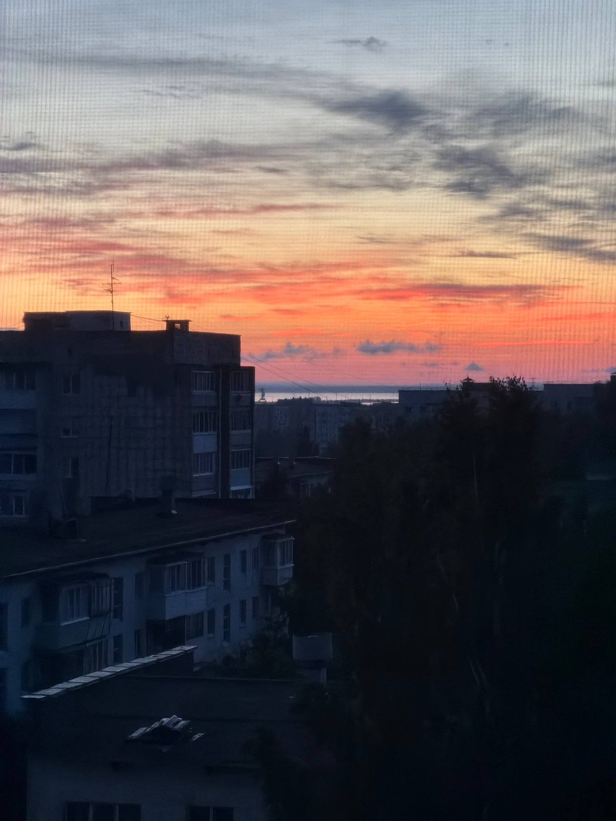 Vivid summer sunset over Chaikovsky, with quiet moments at home