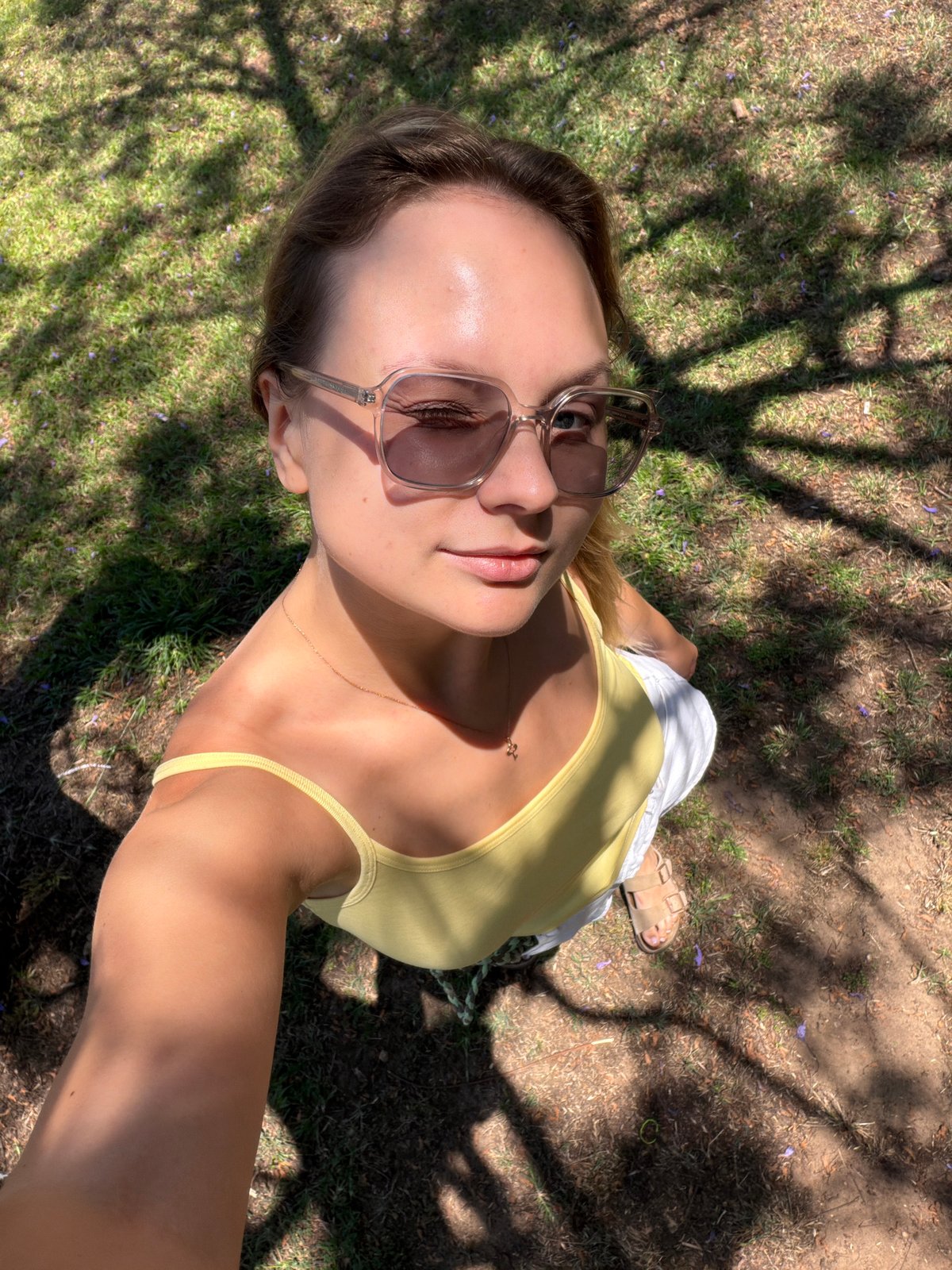 Sunny Tel Aviv selfie session, yellow top, wooden bench