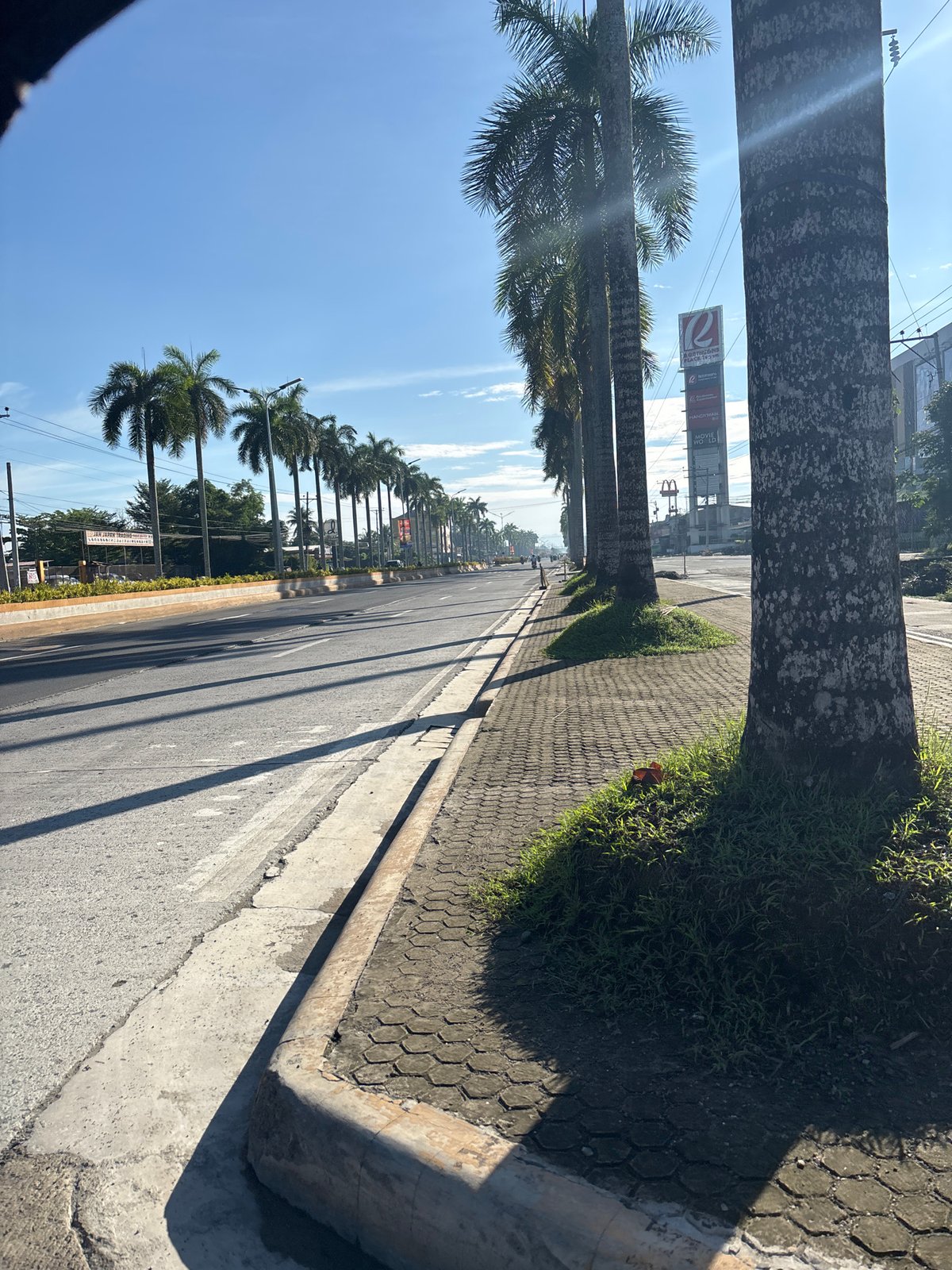 Jogging and driving through sunny Tagum City streets
