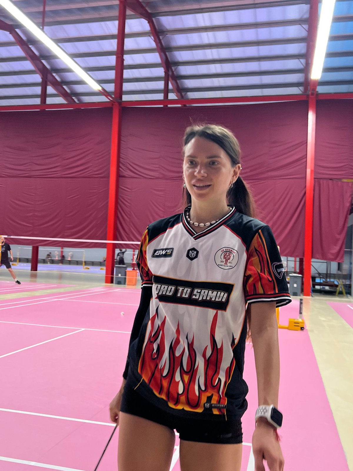 Badminton tournament action on pink courts in Ko Samui