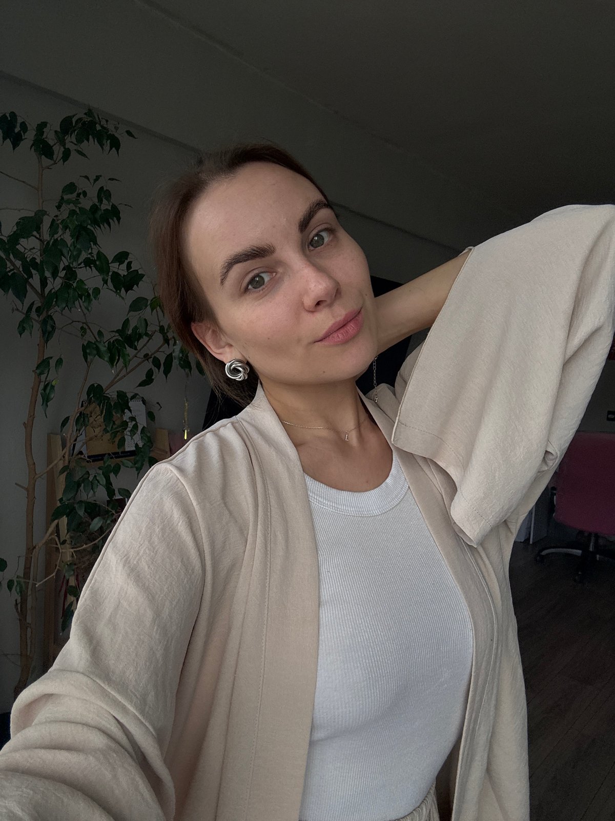 Morning domestic moments captured in Zheleznogorsk: woman, cat at home