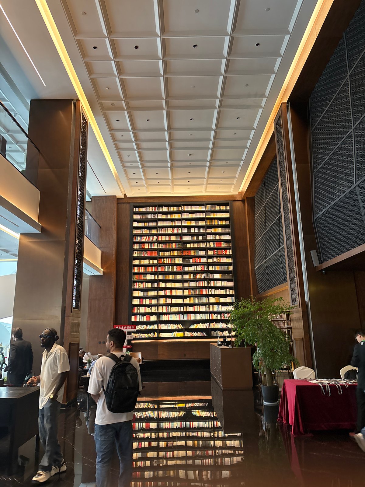 Interior scenes documented at Liangjiang bookstore featuring bronze sculptures