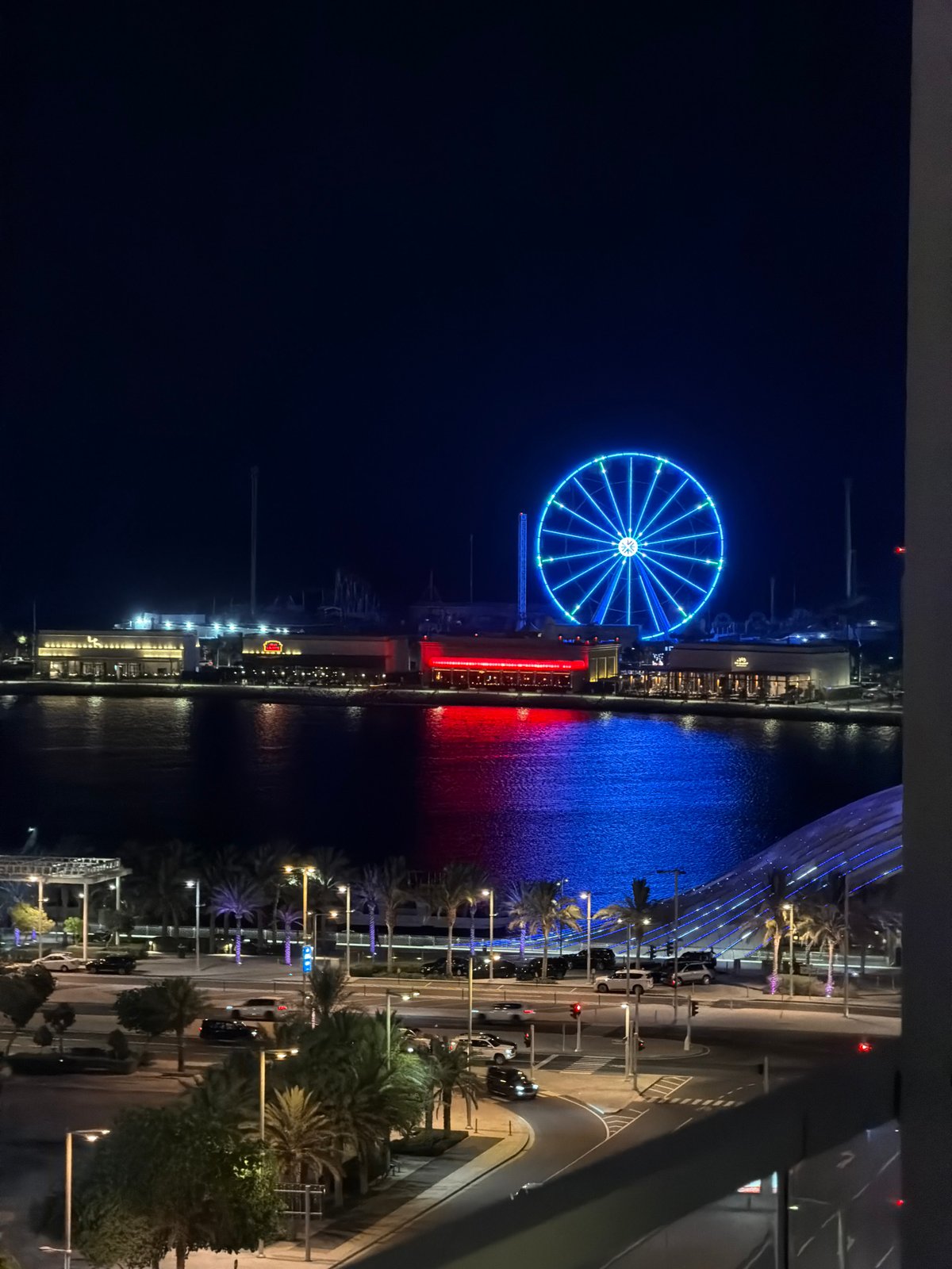 Nighttime views captured of illuminated Lusail waterfront from elevated perspective