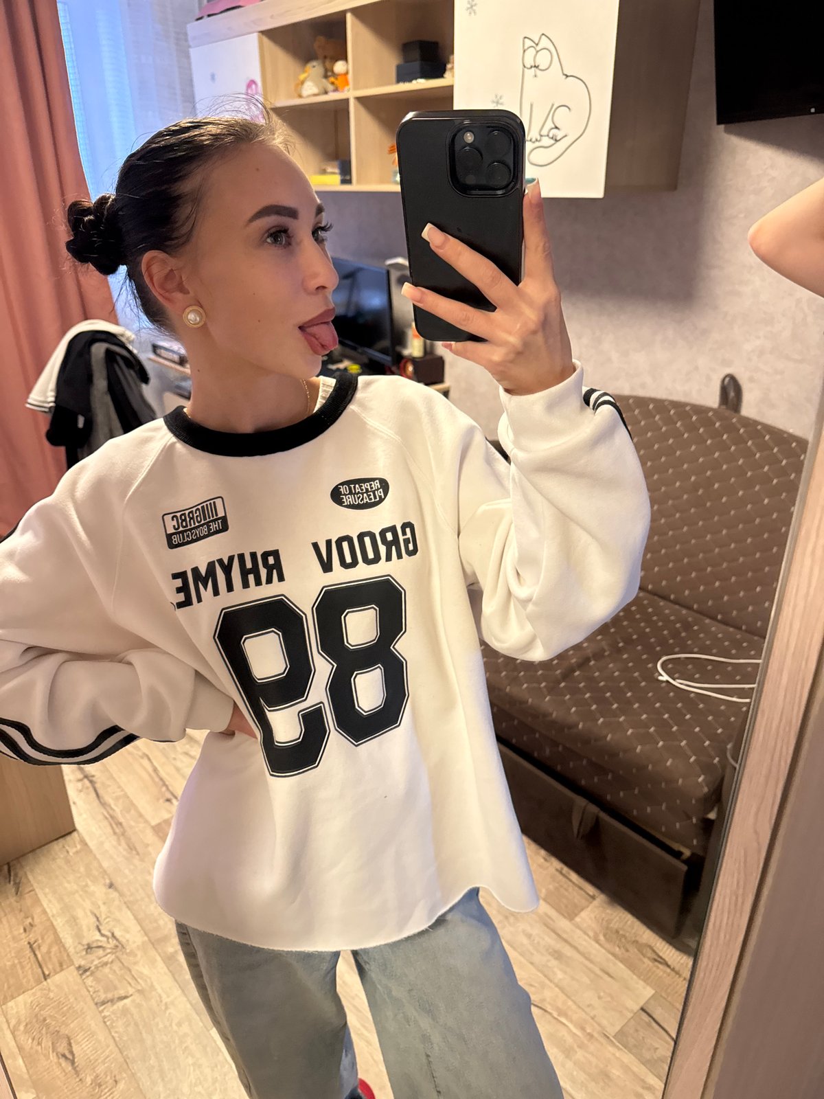 Young women photographed in casual indoor setting in Chaikovsky