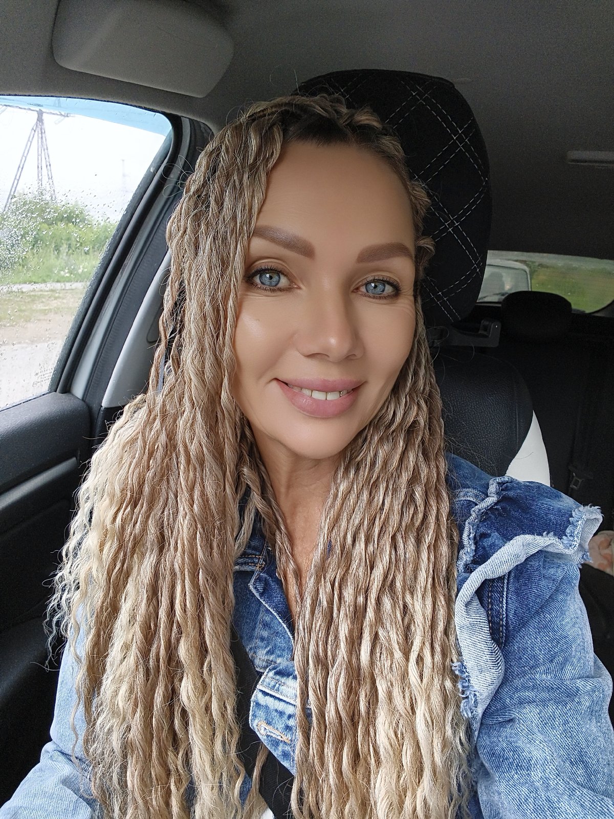 Selfie session in a car, mix of indoor and overcast outdoor shots