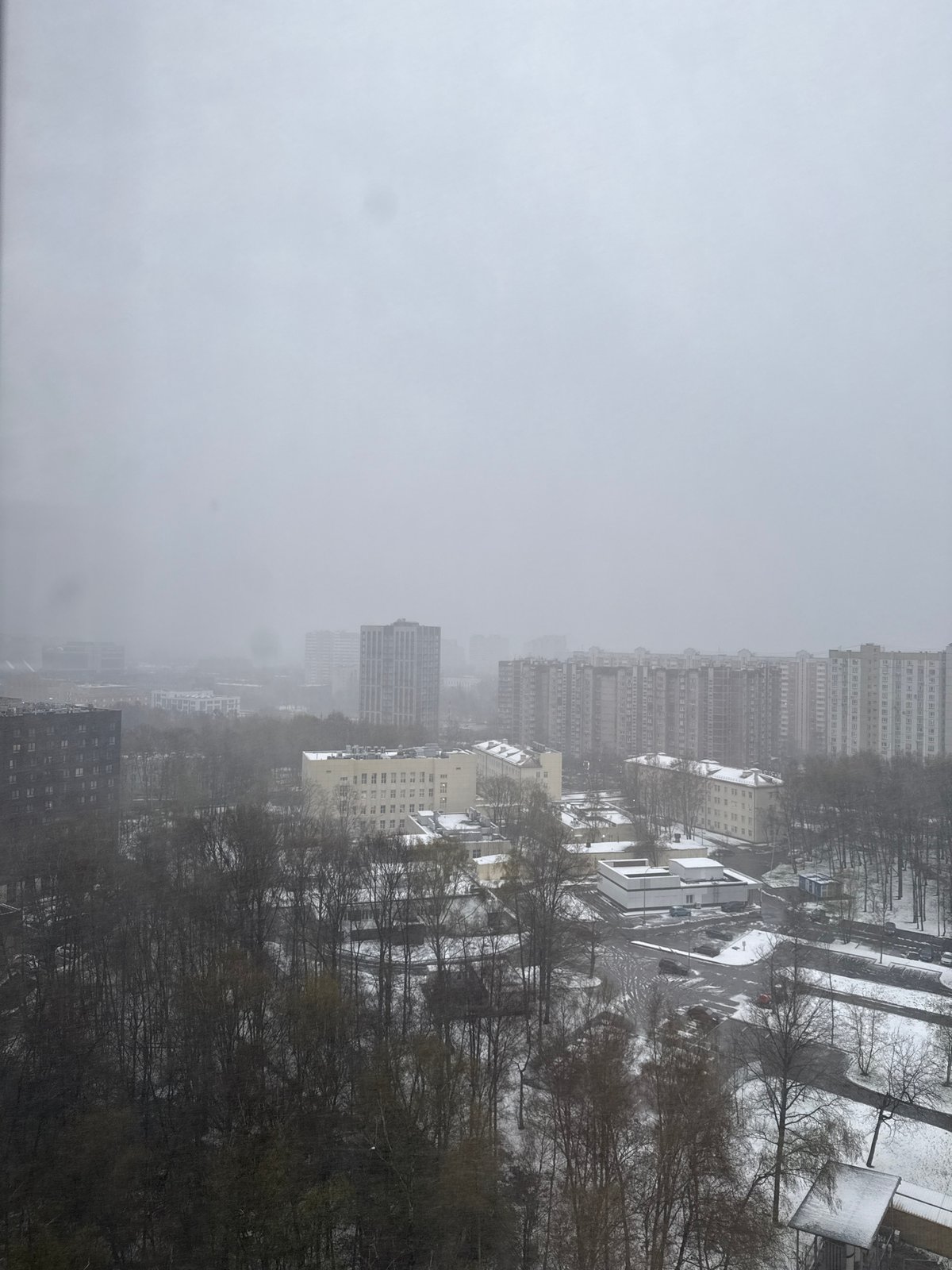 Snowy overcast day observed in Khimki residential district