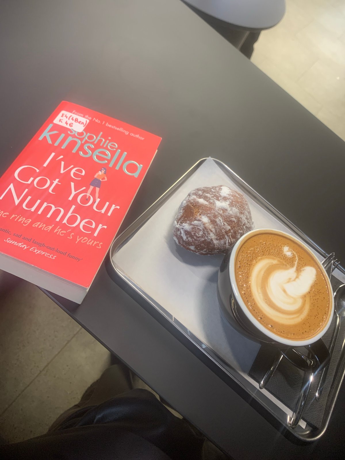 Morning coffee and book moment captured in Izhevsk