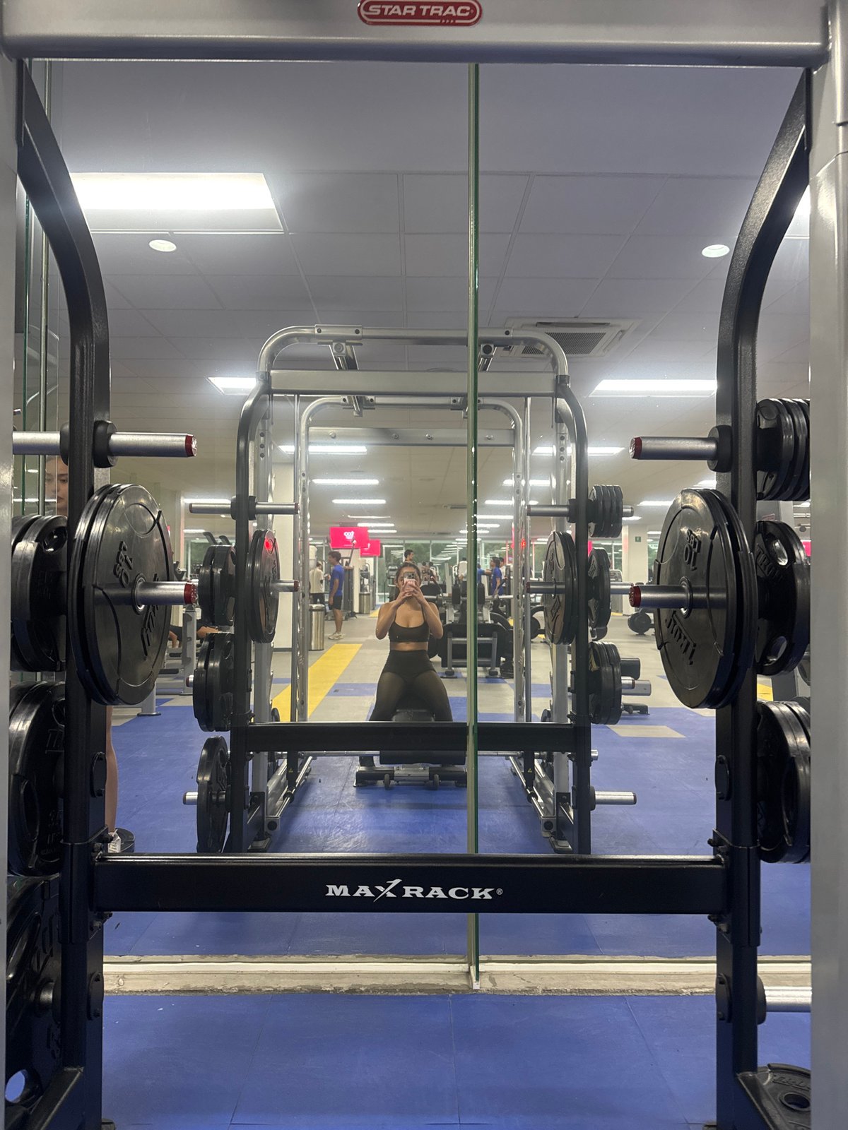 Gym interior captured in mirror reflection in Puebla