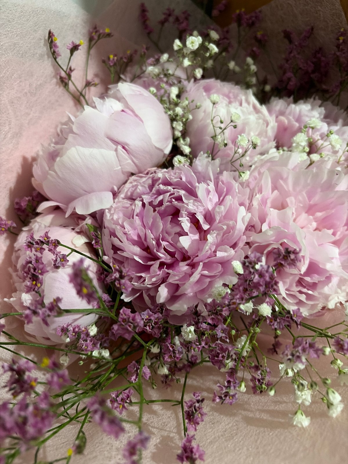 Pink peony bouquet with white, purple accents documented